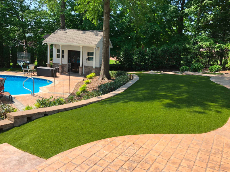 newly installed lawn next to a swimming pool